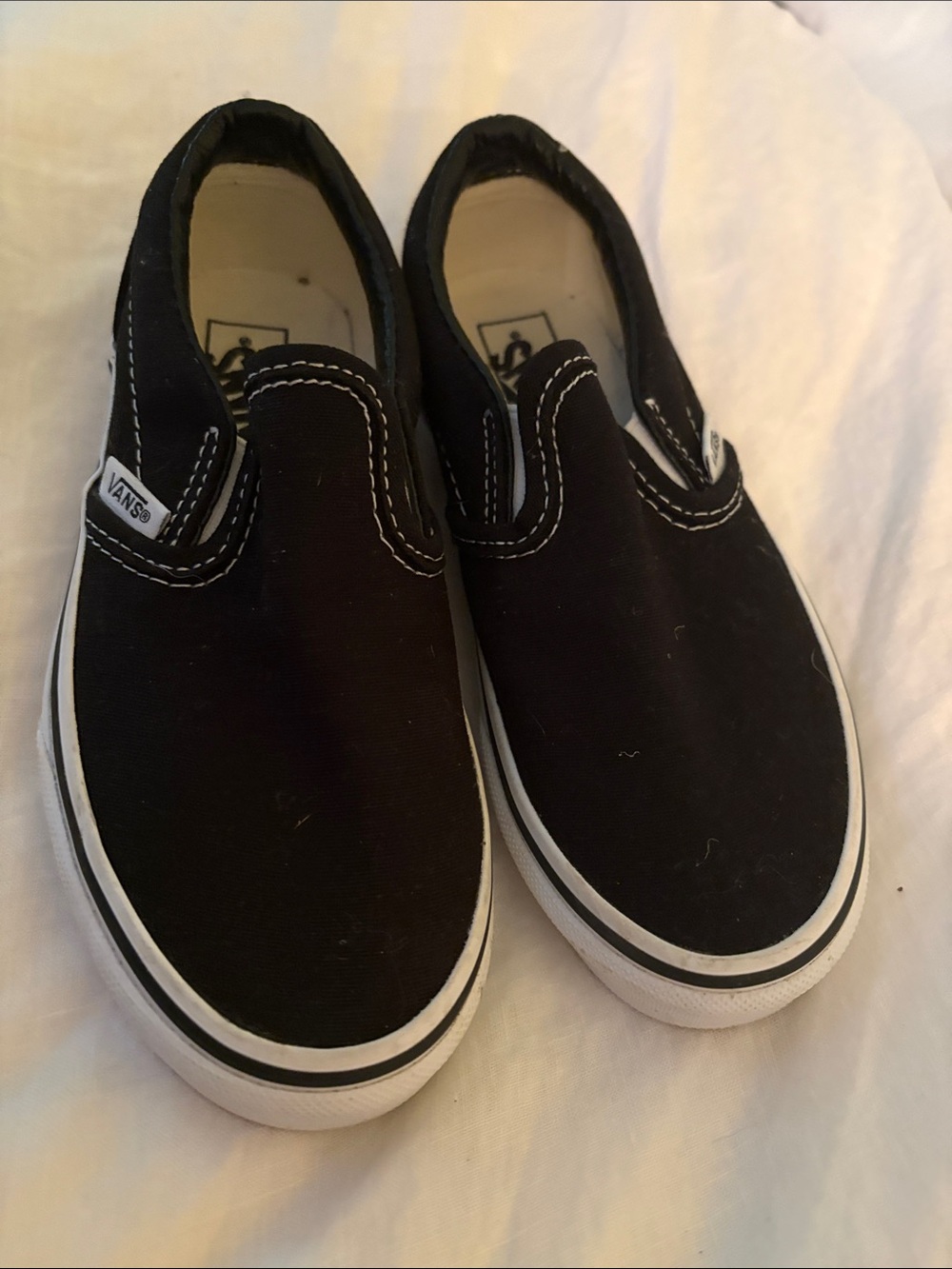 Vans Kids Slip-On Sneakers in Black and White